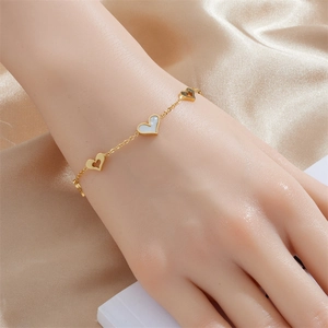 Elegant gold-plated stainless steel chain bracelet with hollow and shell heart charms