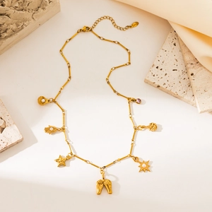 Gold 18K plated stainless steel necklace with sun, moon, and star pendants with pearls