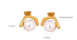 Macro detail of elegant 1.2cm gold plated earrings featuring large white imitation pearls