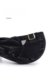 Detailed view of adjustable metal buckle on vintage washed cotton beret for custom fit