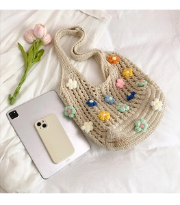 Detailed knit tote bag size comparison with iPad showing the large capacity and flower patterns