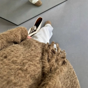 Chic women's oversized brown fuzzy knit cardigan with tie-waist in a casual autumn outfit
