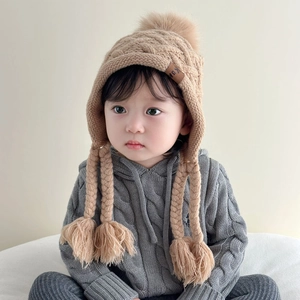 Toddler winter cable knit earflap hat with pompom and braided tassels in khaki color