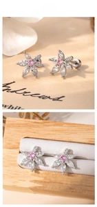 Macro detail of silver floral earring with pink heart zircon and marquise petals