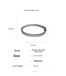 Detail view of zircon snap bangle with 6.3cm x 5.3cm measurements on white background
