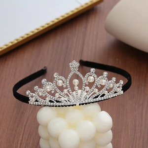 Elegant silver crown headband with sparkling rhinestones and pearls on a sleek black band