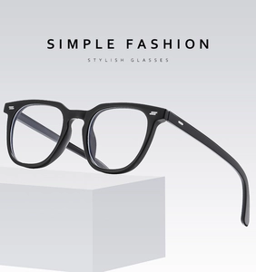Detail of square black eyewear frame featuring silver metallic rivets on the hinge area