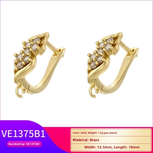 Macro view of 18K gold plated U-shape brass earrings with zircon inlay and hanging loops