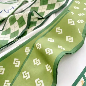 Green and white geometric patterned silk twilly scarf for hair and bag decoration