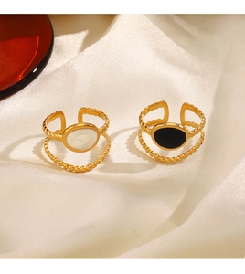 Detail of 18K gold-plated double-layer ring with white shell and black enamel finish