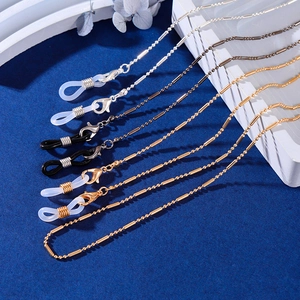 Detail view of gold, silver, and gunmetal glasses chains with adjustable silicone loops