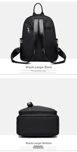 Detail view of black nylon backpack back straps and bottom base with letter printing