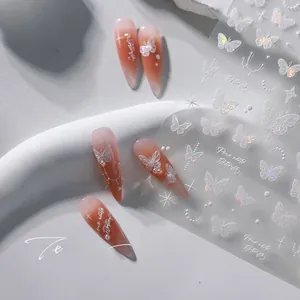 Detail of M-596 nail stickers with 3D white butterflies and pearls on gradient nails