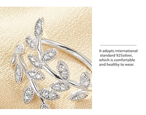 Macro shot of 925 sterling silver olive leaf ring with cubic zirconia stones