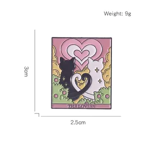 Cat tarot enamel pin featuring black and white cats and The Lovers text on a white background