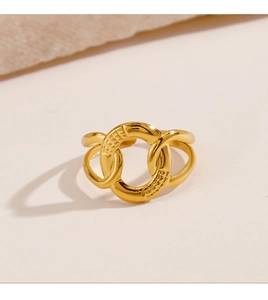 Close-up of geometric 18K gold plated stainless steel ring with intertwined design