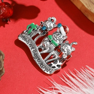 Detail of Christmas cat brooch with rhinestones and Friends Are The Greatest Gift text