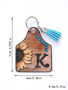 Detail view of sunflower leather keychain with blue tassel showing precise dimensions