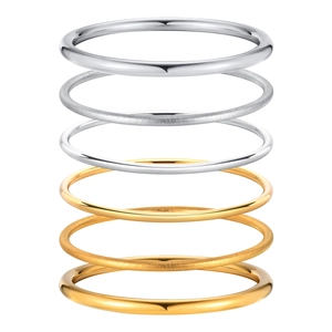 Minimalist gold and silver stainless steel bangles in polished and frosted finishes