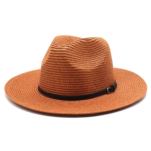 Detail of caramel braided straw fedora featuring a slim black faux leather band