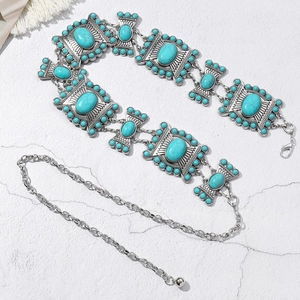 Detailed macro view of bohemian waist chain with turquoise stones and silver-tone metal