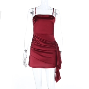 Detail of wine red satin mini dress featuring elegant ruched front and side draped ribbon