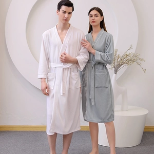 Matching waffle knit bathrobes for couples with V-neck and pockets in white and green