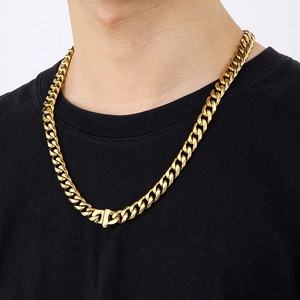 Men's 10mm golden cuban link necklace with buckle worn by model in a close-up shot