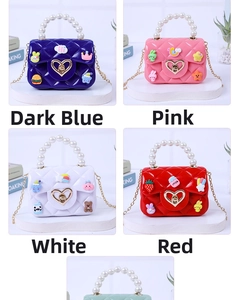 Detailed macro of jelly handbag with pearl handle and cute 3D cartoon charms
