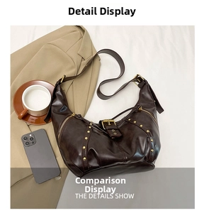 Detail of dark brown vintage leather crossbody bag with golden studs and metal buckle