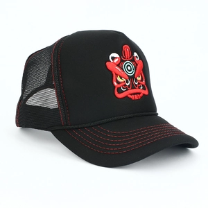 Detail of black trucker hat with red beast embroidery and breathable mesh back