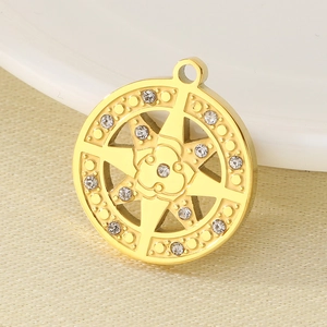 Macro view of gold stainless steel North Star pendant with crystal embellishments