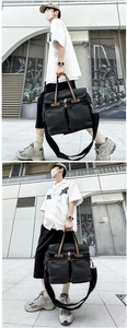 Detail view of large canvas messenger bag with leather straps and front pockets