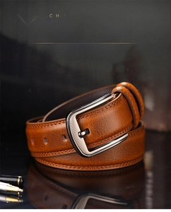Brown leather belt for men with a brushed silver rectangle buckle on a sleek surface