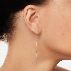 Detailed macro view of 925 sterling silver chain threader earrings with high polish finish