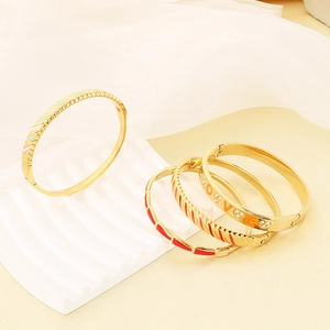 Luxury 18K gold plated stainless steel bangles with LOVE lettering and rhinestone accents