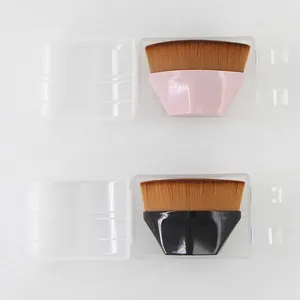 Flat lay of black and pink magic foundation brushes with clear storage cases