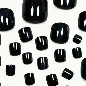 Glossy black short press-on toe nails set in premium ABS material on white background