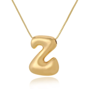 Detailed view of 3D rounded gold letter Z pendant necklace with polished finish