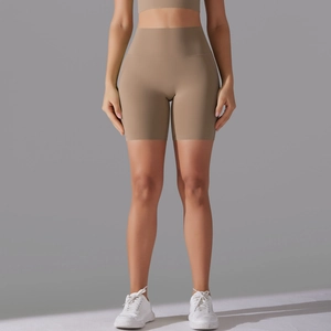 Detailed fit of high-waist seamless yoga shorts in matte camel brown sports fabric