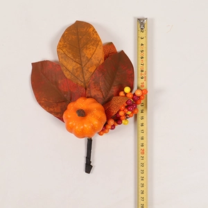 Detail view of 21cm autumn decoration pick with pumpkin and berries measuring on tape