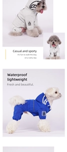 Detail view of waterproof pet raincoat with hood and reflective strips for safety