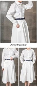 Detail of a dark blue braided wax rope belt styled with a white shirt dress for women