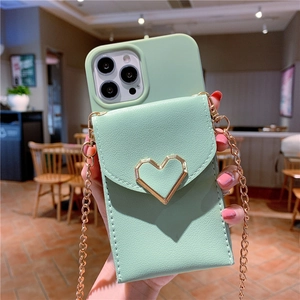 Detail of light green PU leather phone case with golden heart buckle and metal chain strap