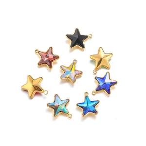 Macro shot of colorful star-shaped stainless steel pendants with crystal inlay details