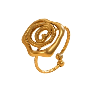 Detail of liquid gold rose ring featuring hammered metal texture and flowy design
