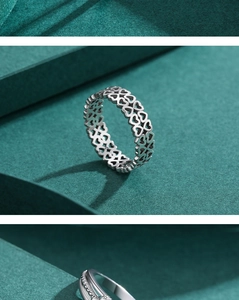 Detailed view of silver S925 sterling silver heart rings and diamond-set bands