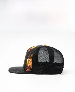 Detail of floral truck hat side panel featuring breathable mesh and crocodile textured brim