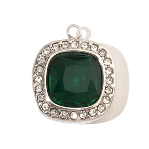 Macro detail of square emerald pendant with zircon star and white rhinestone halo