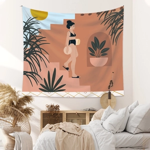 Detail view of Bohemian tapestry with artistic female illustration in a minimalist bedroom